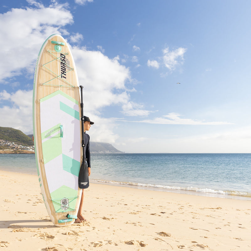 Cargue la imagen en el visor de la galería, boy standing by a sup at the beach